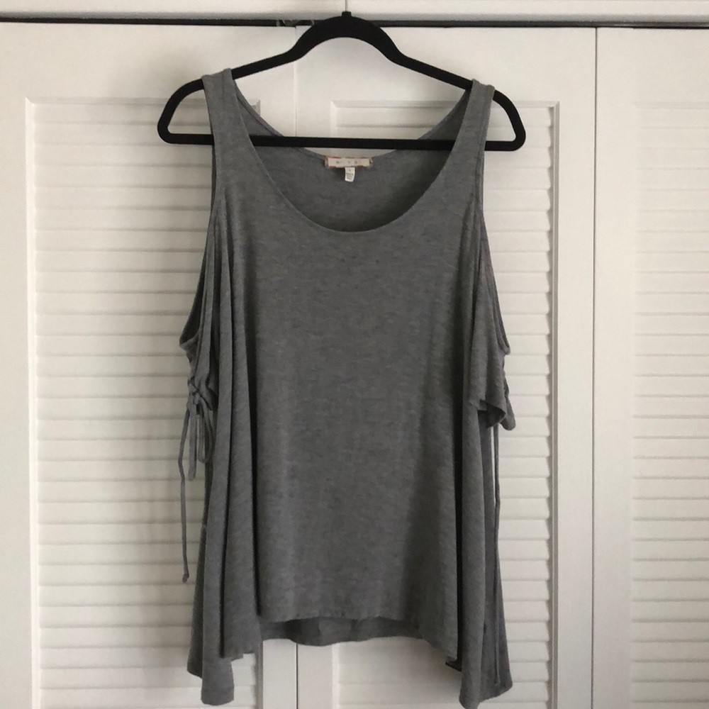 Lace up, sleeve cold, shoulder swing top!